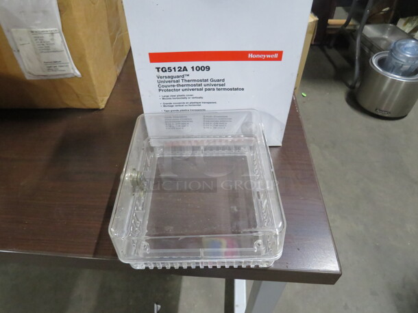 One NEW Honeywell Thermostat Guard. # TG512A.  - Image 1 of 3