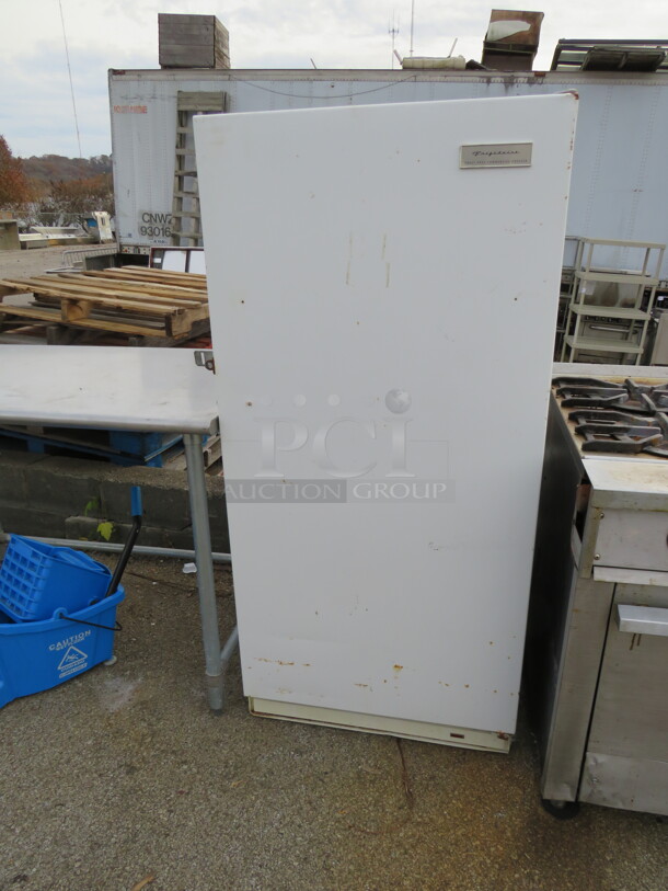 One Frigidaire 1 Door Freezer With 1 Rack. Working When Removed. Model# FFU14FC. 115 Volt. 28X28X60 - Image 1 of 2
