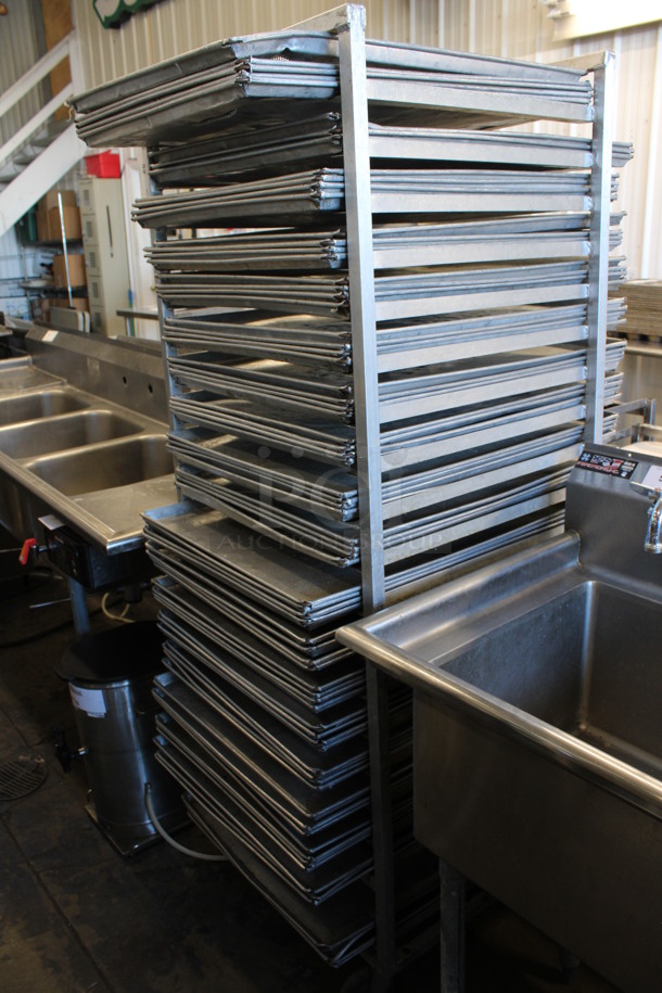 Metal Commercial Pan Transport Rack w/ 73 Perforated Baking Pans on Commercial Casters. 25.5x23.5x70.5. Baking Pans 23x28x1