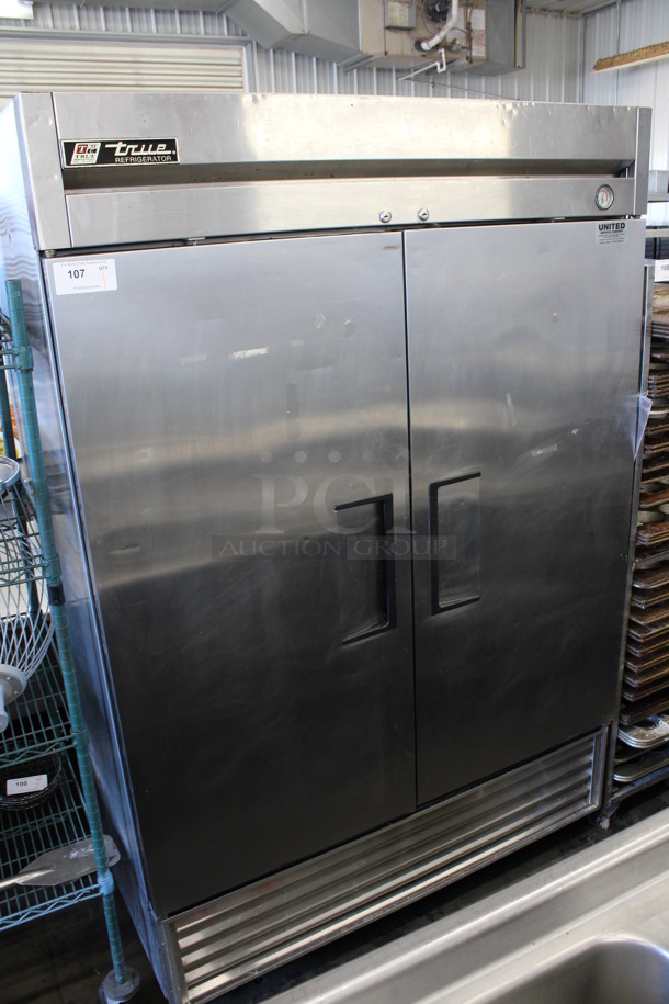 True Model T-49 Stainless Steel Commercial 2 Door Reach In Cooler w/ Poly Coated Racks on Commercial Casters. 115 Volts, 1 Phase. 54x30x82. Tested and Working!