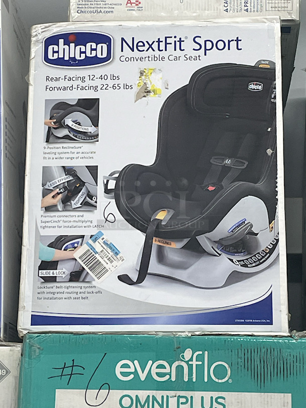MASSIVE LOT! (3) Little Tikes 2-In-1 Snug & Secure Swings – 1 Blue, 2 Pink; (17) Nuby Water Resistant Baby Bibs (assorted colors); (1) Graco “Caden Fashion” Comfy Cruiser™ Travel System With Snugride® 30; (1) Allen YOOGO CZ2 Convertible Cargo Trailer → Handy Pull Cart,  (1) Delta Children Sweet Slumber Bassinet, (1) Chicco LullaGo Portable Bassinet, (1) Chicco NextFit Sport Convertible Car Seat, (2) Evenflo Omni Plus Modular Travel System – Includes LITEMAX Rear-Facing Infant Car Seat, (1) Baby Trend EZ Ride Girl 35 - Includes NEW 4-35 Ibs Infant Car Seat , (1) Evenflo Nurture Infant Car Seat Base. 11x Your Bid - Image 9 of 12