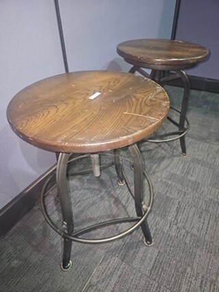 ALL ONE MONEY Set of 2 black metal framed stools with wooden seats. Has scuffs and scratches as shown in pictures but can be cleaned up nicely! Nothing broken. 25”H x 18”W x 18.5” D.
