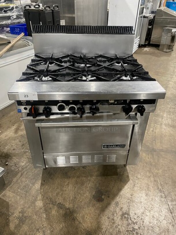 Garland Commercial Natural Gas Powered 6 Burner Stove! With Back Splash! With Convection Oven Underneath! Metal Oven Rack! All Stainless Steel! - Image 1 of 9