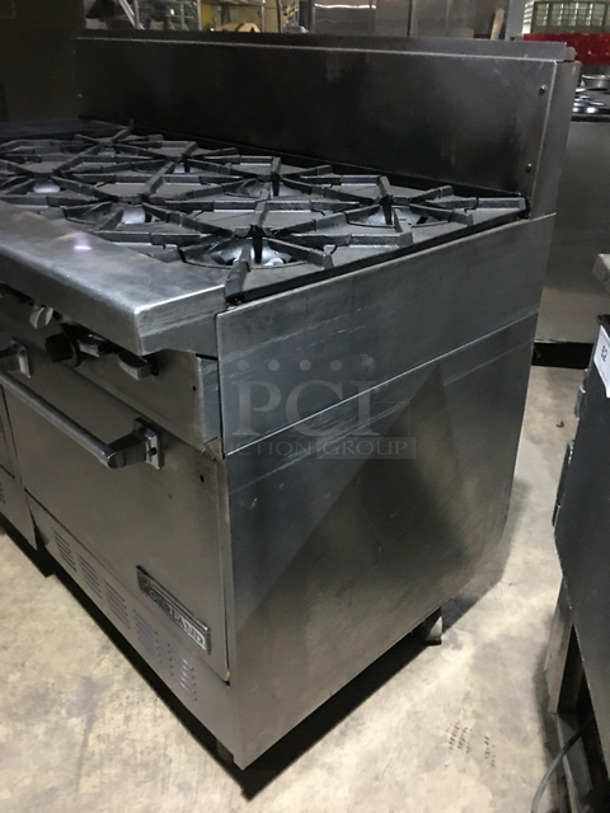 AN ANMAZING FIND! Garland 8 Burner Stove! With Left Side Hot Plate! With Back Splash! With 2 Full Size Ovens Underneath! With Metal Oven Racks! All Stainless Steel! On Casters! - Image 2 of 10