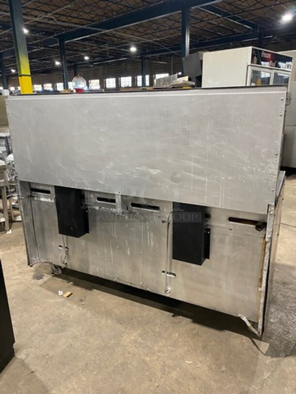 AMAZING FIND! Garland Natural Gas Powered 12 Burner Stove! With 2 Full-Sized Ovens! With Metal Oven Racks! With Raised Back Splash & Salamander Shelf! Stainless Steel! On Casters! - Image 2 of 9
