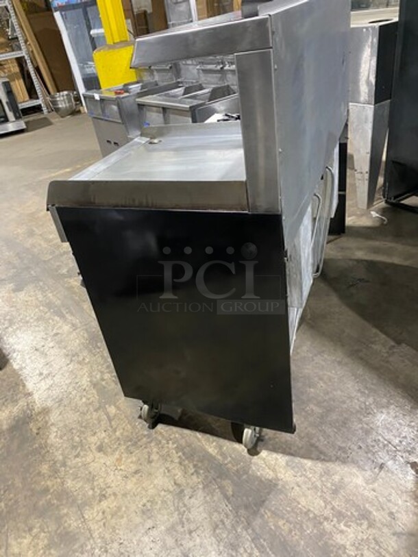 GREAT FIND! Garland Commercial Gas Powered 6 Burner Stove With Right Side Flat Griddle! Griddle Has Side Splashes! With Raised Back Splash And Salamander Shelf! With 2 Oven Underneath! Metal Oven Racks! All Stainless Steel! On Casters! Working When Removed! - Image 4 of 12