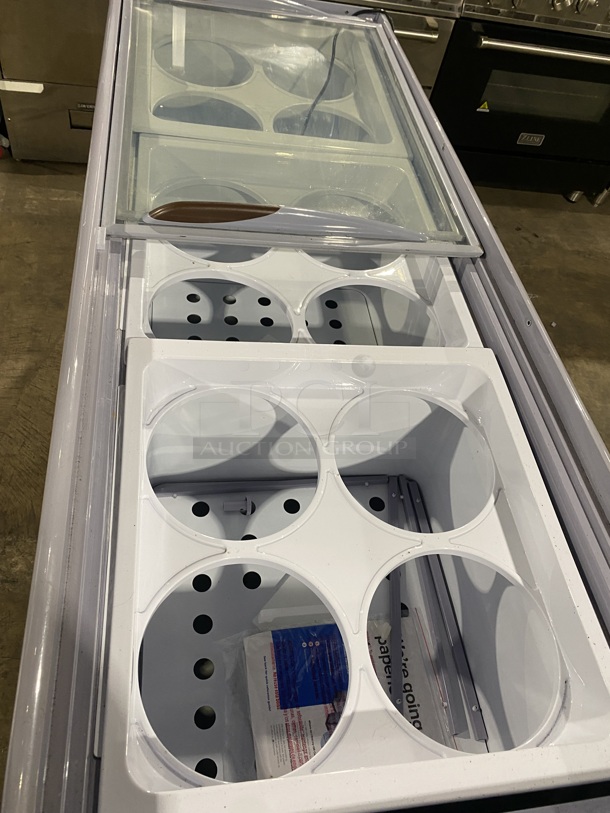 BRAND NEW SCRATCH AND DENT! Avantco 360ADC12HC Metal Commercial Floor Style Ice Cream Dipping Cabinet Merchandiser w/ Ice Cream Tub Collars. Stock Picture Used For Gallery Picture. 115 Volts, 1 Phase.  - Image 5 of 8