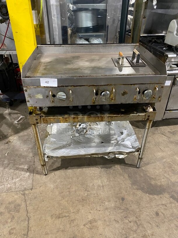 GREAT! Star Commercial Natural Gas Powered Flat Griddle! On Equipment Stand! With Back & Side Splashes! With Underneath Storage Space! With Weighted Wood Handle Meat/Hamburger Press! On Legs! WORKING WHEN REMOVED! - Image 1 of 8