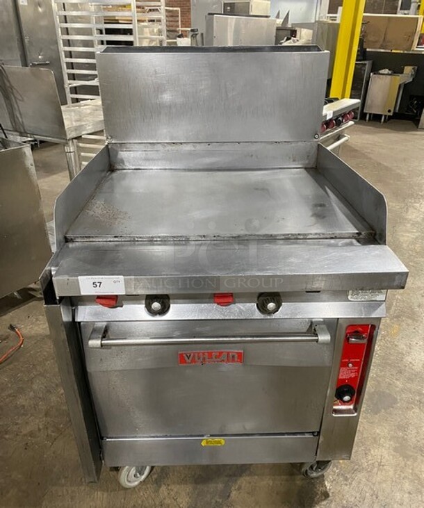 NICE! Vulcan Commercial Natural Gas Powered Flat Top Griddle! With Side/Back Splashes! With Oven Underneath! Stainless Steel! On Casters!
