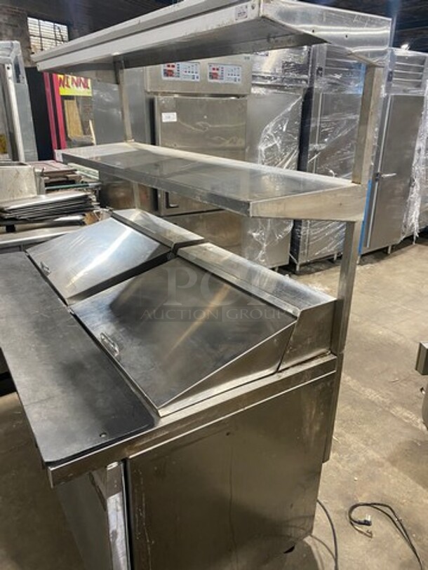 Continental Commercial Refrigerated Sandwich Prep Table! With Double Over Head Shelf! With 2 Door Underneath Storage Space! With Poly Coated Racks! All Stainless Steel! Model: SW6024M Serial 15713729! 115V 1Phase! On Casters!
 - Image 2 of 10