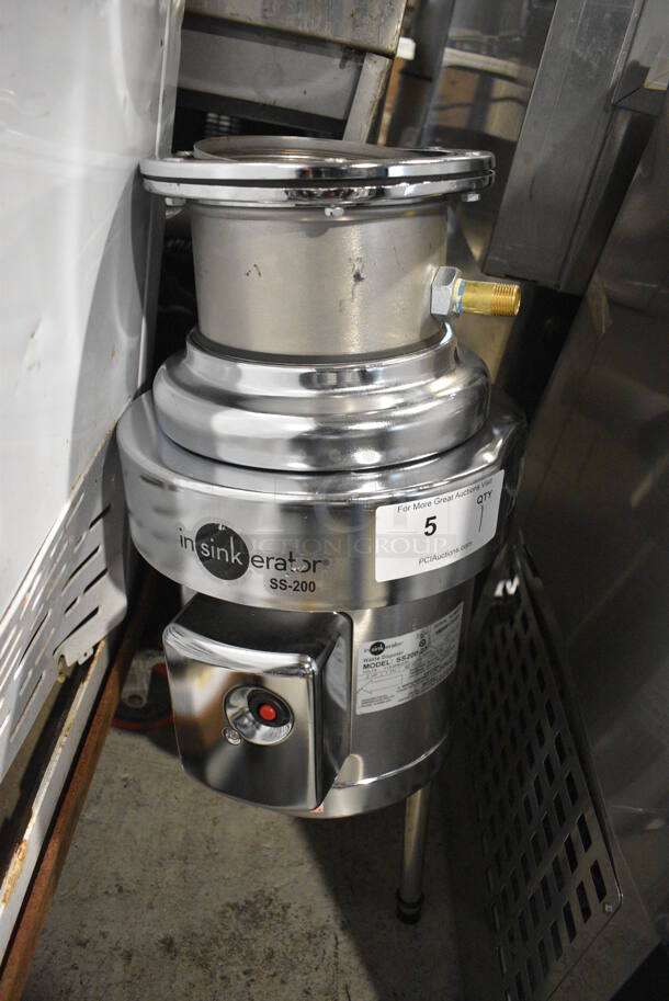 BRAND NEW SCRATCH AND DENT! Insinkerator Model SS200-27 Stainless Steel Commercial Garbage Waste Disposal. Goes Great w/ Lot # 197! 115/208/230 Volts, 1 Phase. 11x16x28