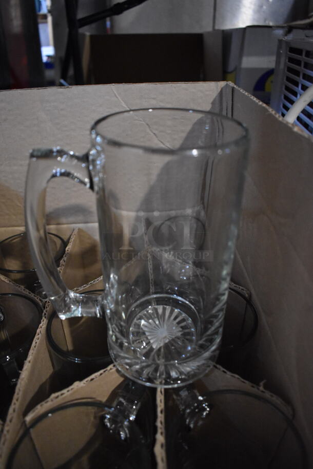 2 Boxes of BRAND NEW Glasses; 10 Large Glass Mugs and 12 Bradford Cooler Glasses. 5.5x3.5x7, 3x3x6. 2 Times Your Bid!