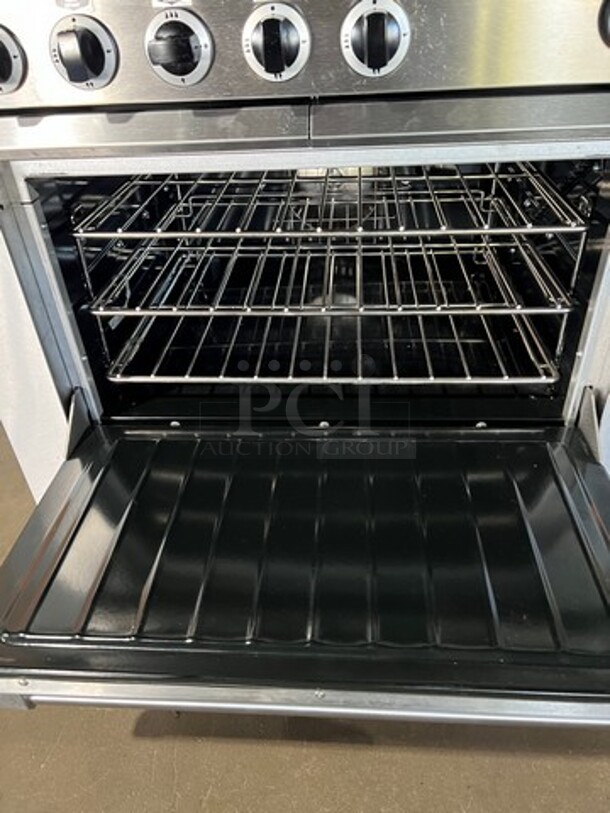 WOW! NEW OUT OF THE BOX! NEVER USED! Garland Heavy Duty Commercial Electric Powered 6 Burner Range With Full Size Convection Oven Underneath! All Stainless Steel Body! With Oven Racks! Model 36ER33 - Image 6 of 9