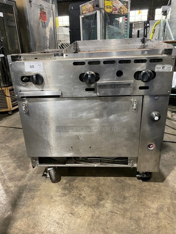 Vulcan Commercial Natural Gas Powered 2 Burner Stove With Flat Top Griddle! Griddle Has Back And Side Splashes! With Oven Underneath! All Stainless Steel! On Casters! Model: 36S2B24GN SN: 481883161