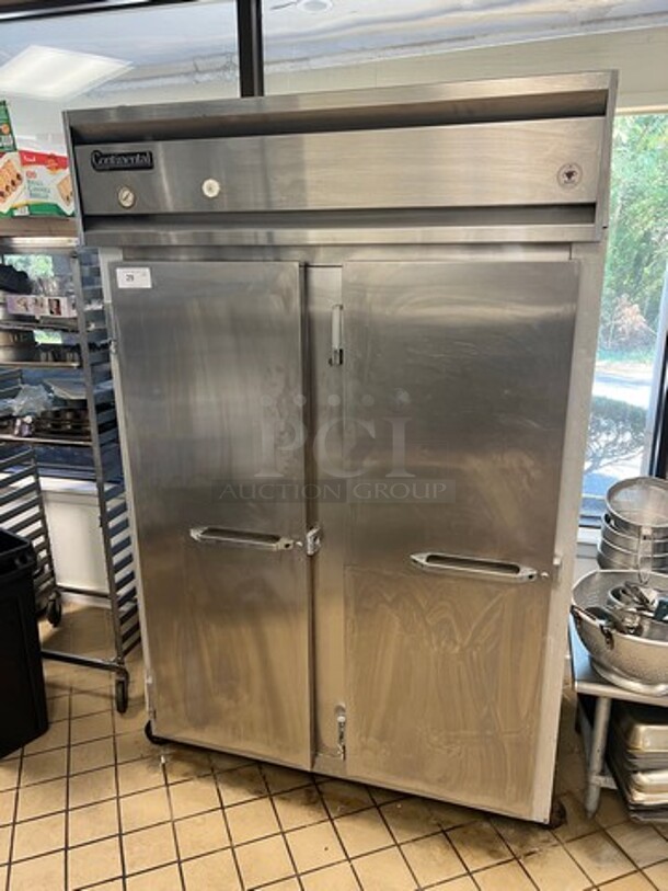 Continental Commercial 2 Door Reach In Freezer! With Poly Coated Racks! Solid Stainless Steel! On Casters! WORKING WHEN REMOVED! Model: 2F SN: 132A9665 115V 60HZ 1 Phase