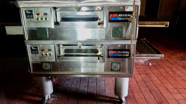 One Middleby Marshall Natural Gas Double Stack Conveyor Pizza Oven On Casters. Unable To Test. Model# PS555G. 208/240 Volt. 1 Phase. WORKING WHEN REMOVED!!!