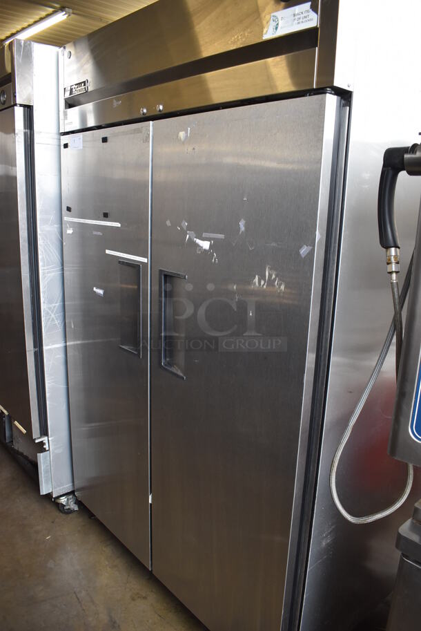 2011 True TG2F-2S Stainless Steel Commercial 2 Door Reach In Freezer w/ Poly Coated Racks on Commercial Casters. 115 Volts, 1 Phase. 51x35x83. Tested and Working!