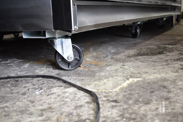 BRAND NEW SCRATCH AND DENT! 2024 Avantco 178SS3RHC Stainless Steel Commercial 3 Door Reach In Cooler w/ Poly Coated Racks on Commercial Casters. 115 Volts, 1 Phase. Tested and Working! - Image 3 of 7