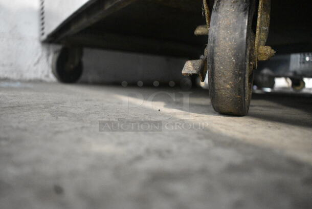 US Range C836-7 Stainless Steel Commercial Natural Gas Powered 4 Burner Range w/ Oven and Back Splash on Commercial Casters.  - Image 3 of 9