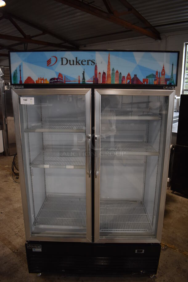 Dukers DSM-41R Metal Commercial 2 Door Reach In Cooler Merchandiser w/ Poly Coated Racks on Commercial Casters. 115 Volts, 1 Phase. Tested and Working!