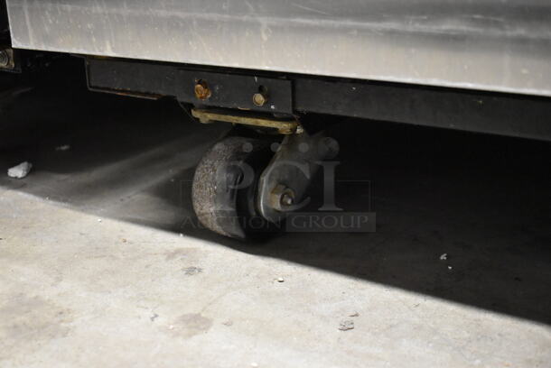 2013 True TG1R-1S ENERGY STAR Stainless Steel Commercial Single Door Reach In Cooler w/ Poly Coated Racks on Commercial Casters. 115 Volts, 1 Phase. Tested and Working! - Image 7 of 7