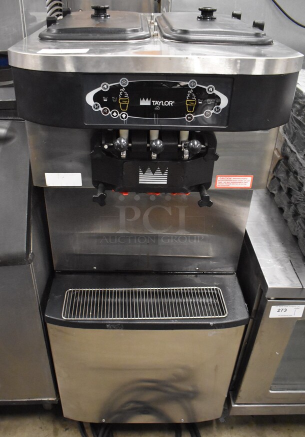 Taylor C713-33 Stainless Steel Commercial Floor Style Air Cooled 2 Flavor w/ Twist Soft Serve Ice Cream Machine on Commercial Casters. 208-230 Volts, 3 Phase. 25x38x60