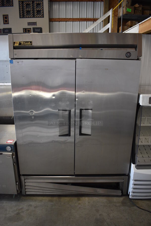 2013 True Model T-49F ENERGY STAR Stainless Steel Commercial 2 Door Reach In Freezer w/ Poly Coated Racks on Commercial Casters. 115 Volts, 1 Phase. 54x30x79. Tested and Working!