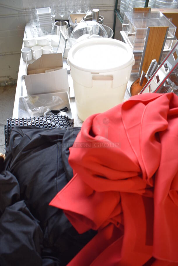 ALL ONE MONEY! Lot of Items on Tabletop Including Material, Poly Bucket, Ceramic Mugs and Wine Glasses and Metal Bins - Image 1 of 12