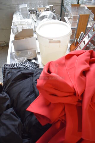 ALL ONE MONEY! Lot of Items on Tabletop Including Material, Poly Bucket, Ceramic Mugs and Wine Glasses and Metal Bins