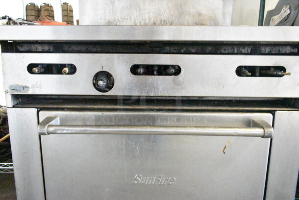 Garland SunFire Stainless Steel Commercial Natural Gas Powered 6 Burner Range w/ Oven, Back Splash and Contents on Commercial Casters.  - Image 6 of 7