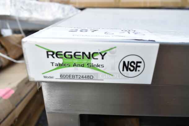 BRAND NEW SCRATCH AND DENT! Regency 600EBT2448D 24" x 48" 16 Gauge Type 304 Stainless Steel Enclosed Base Table with Sliding Doors and Adjustable Midshelf - Image 4 of 4