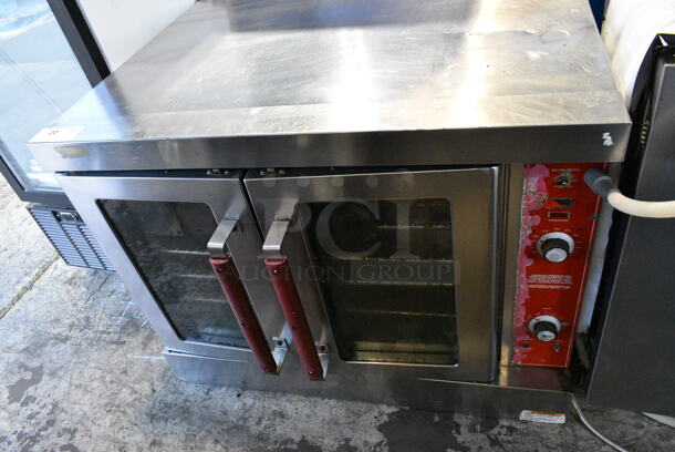 Vulcan VC4GD-10 Stainless Steel Commercial Natural Gas Powered Full Size Convection Oven w/ View Through Doors, Metal Oven Racks, Metal Legs and Thermostatic Controls.  - Image 1 of 7