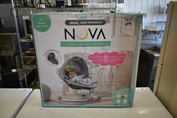 BRAND NEW SCRATCH AND DENT! Nova Soothing Musical Baby Swing.