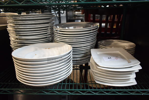 ALL ONE MONEY! Tier Lot of White Ceramic Plates. - Image 1 of 6