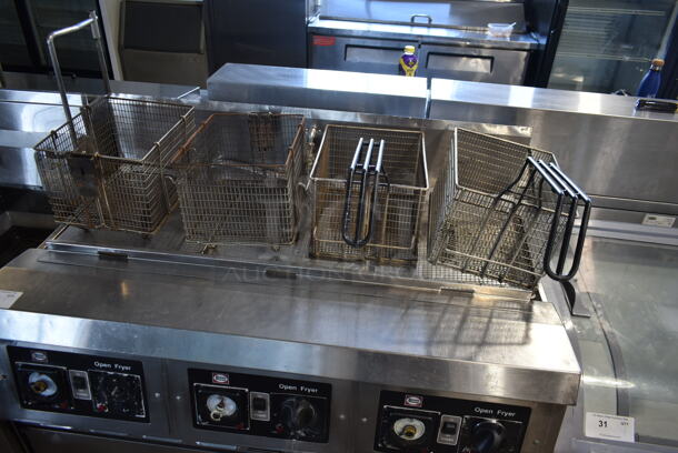 Henny Penny CG-303 Stainless Steel Commercial Floor Style  Natural Gas Powered 3 Bay Deep Fat Fryer w/ 3 Lids and 4 Metal Fry Baskets on Commercial Casters. 240,000 BTU. - Image 6 of 10