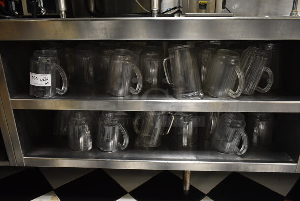 ALL ONE MONEY! Lot of Items on 2 Under Shelves Including Poly Pitchers. (ice room) - Image 1 of 5