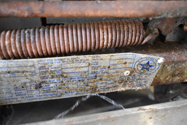 Garland M44R Stainless Steel Commercial Natural Gas Powered 4 Burner Range w/ Oven, Over Shelf and Back Splash on Commercial Casters.  - Image 9 of 9