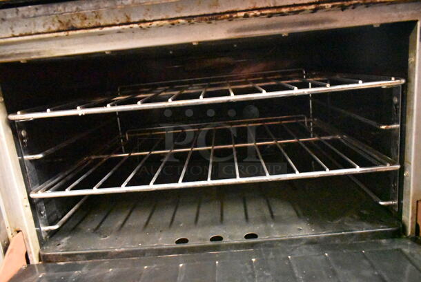 Garland PS-24G-6-2628 Stainless Steel Commercial Natural Gas Powered 6 Burner Range w/ Left Side Flat Top, 2 Ovens, Over Shelf and Back Splash.  - Image 8 of 11