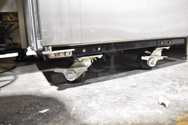 LATE MODEL! True ENERGY STAR Stainless Steel Commercial Single Door Reach In Cooler on Commercial Casters. See Pictures for Dent on Side. 115 Volts, 1 Phase. Tested and Working! - Image 2 of 4
