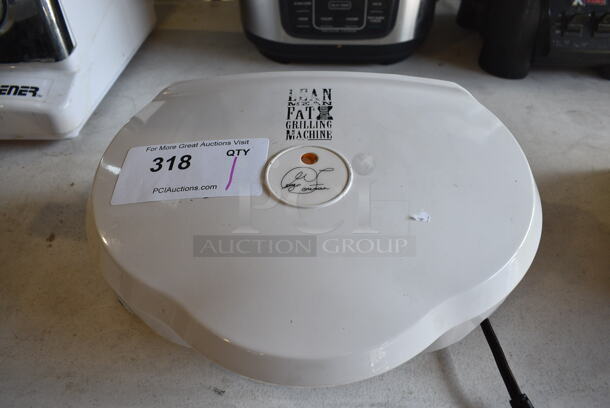 George Foreman Model GR12 Metal Countertop Grilling Machine. 120 Volts, 1 Phase. 12.5x9x5