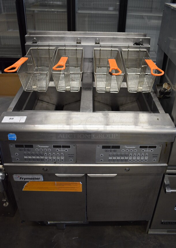 2015 Frymaster Model 2FQG30U0ZQ3ZZNG Stainless Steel Commercial Floor Style Natural Gas Powered 2 Bay Deep Fat Fryer w/ 4 Metal Fry Baskets on Commercial Casters. 75,000 BTU. 31x30x47