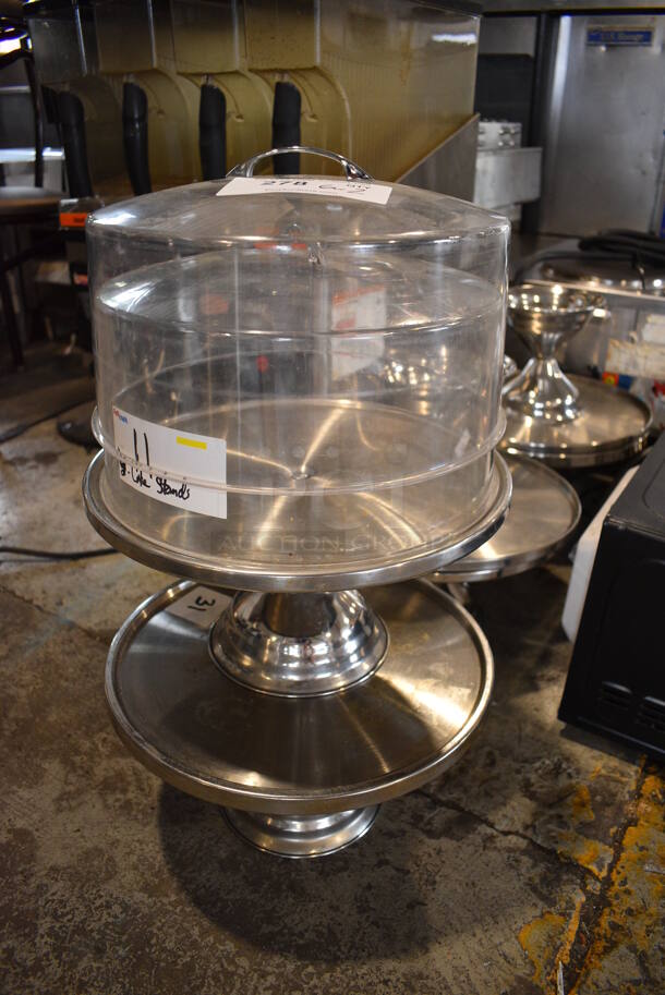 6 Metal Countertop Cake Stands w/ 2 Poly Dome Lids. 13x13x7 12x12x7. 6 Times Your Bid!