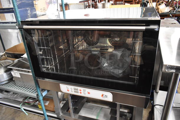 BRAND NEW SCRATCH AND DENT! Cooking Performance Group CPG B04DU.3-001 Stainless Steel Commercial Electric Powered Convection Oven w/ Pan Rack on Commercial Casters. 208-240 Volts, 1 Phase. - Image 3 of 9