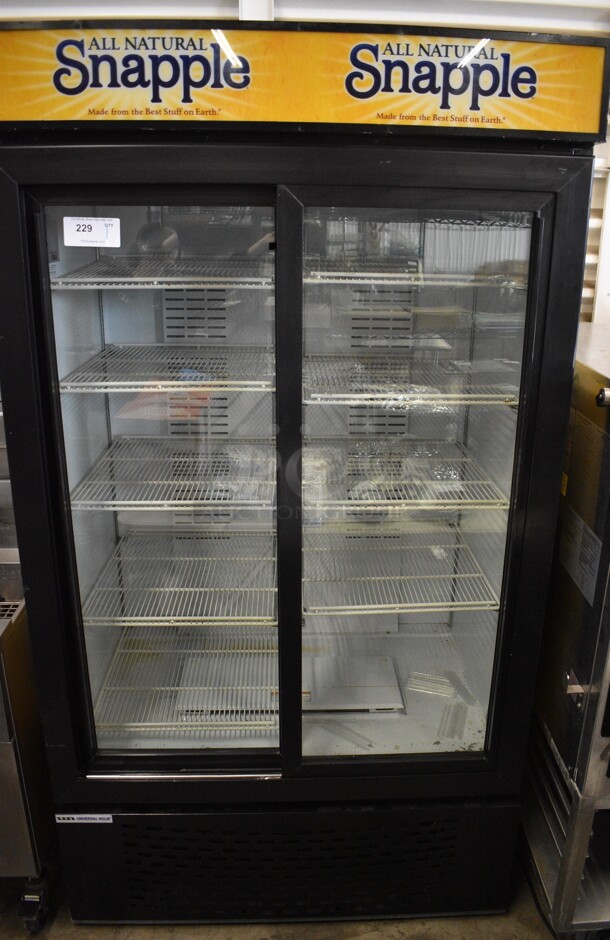 Universal Model MC1100S-1 Metal Commercial 2 Door Reach In Cooler Merchandiser w/ Poly Coated Racks. 115 Volts, 1 Phase. 43.5x32x79. Tested and Powers On But Does Not Get Cold