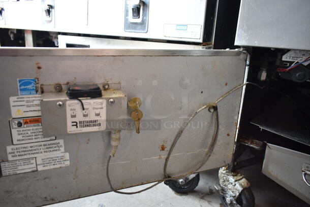 2020 Henny Penny OGA-323 ENERGY STAR Stainless Steel Commercial Natural Gas Powered 3 Bay Fryer w/ 3 Metal Fry Baskets on Commercial Casters. 255,000 BTU.  - Image 10 of 12