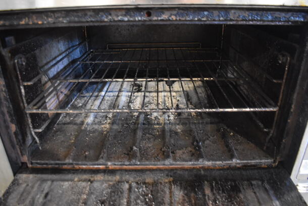 Wolf FHBO-6 Stainless Steel Commercial Natural Gas Powered Vertical Upright Broiler on Commercial Casters.  - Image 7 of 8