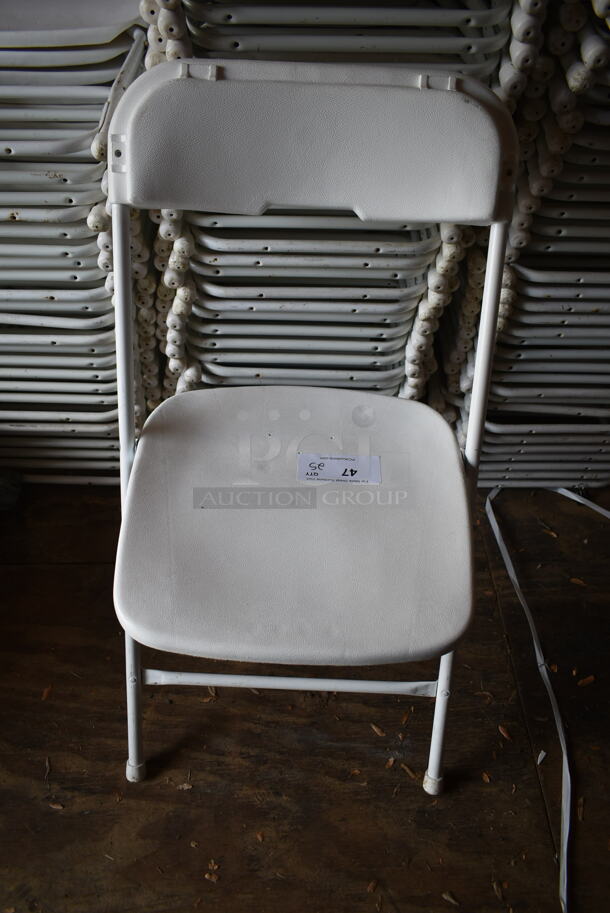 50 White Poly and Metal Folding Chairs. Stock Picture - Cosmetic Condition May Vary. 50 Times Your Bid! BUYER MUST REMOVE.(outside shed) - Image 2 of 5