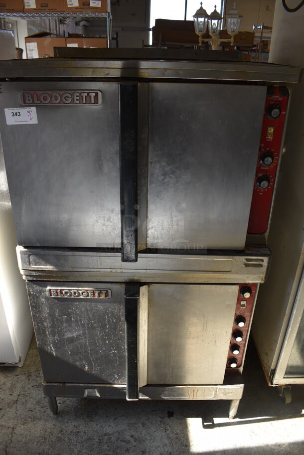 2 Blodgett Stainless Steel Commercial Electric Powered Full Size Convection Ovens w/ Solid Doors, Metal Oven Racks and Thermostatic Controls. 208-220 Volts. 38.5x40x64.5. 2 Times Your Bid!