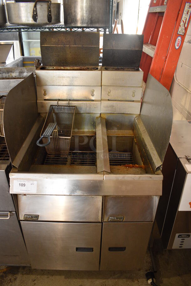 Pitco Frialator Stainless Steel Commercial Floor Style Natural Gas Powered Double Bay Deep Fat Fryer w/ 1 Metal Fry Basket and 2 Side Splash Guards. 26x32x56
