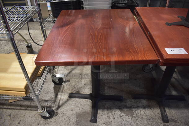 2 Wood Pattern Dining Tables on Black Metal Table Base. Stock Picture - Cosmetic Condition May Vary. 24x30x30. 2 Times Your Bid!